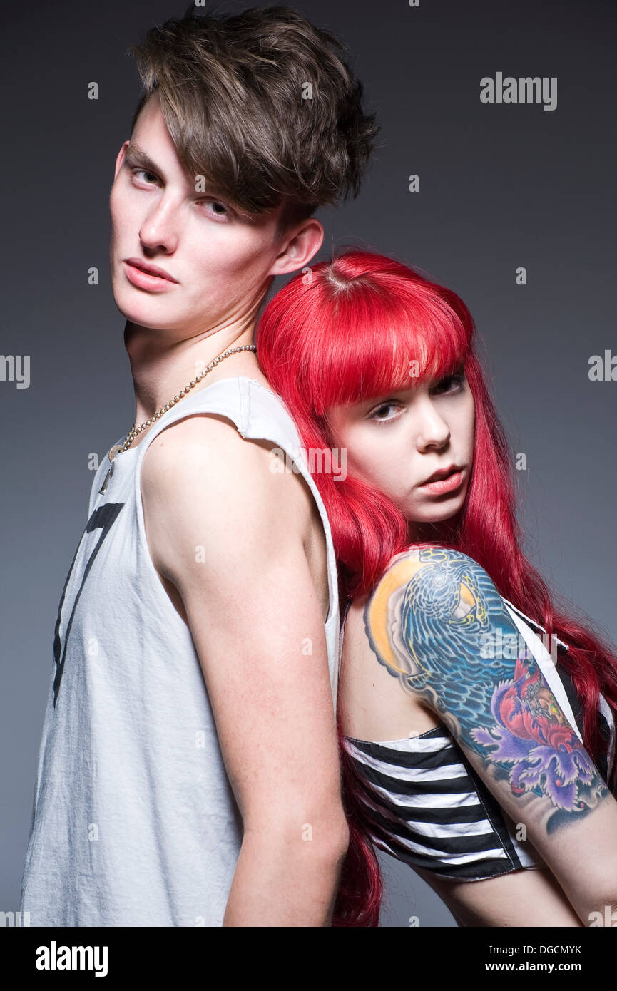 Young couple leaning against each other, portrait Stock Photo