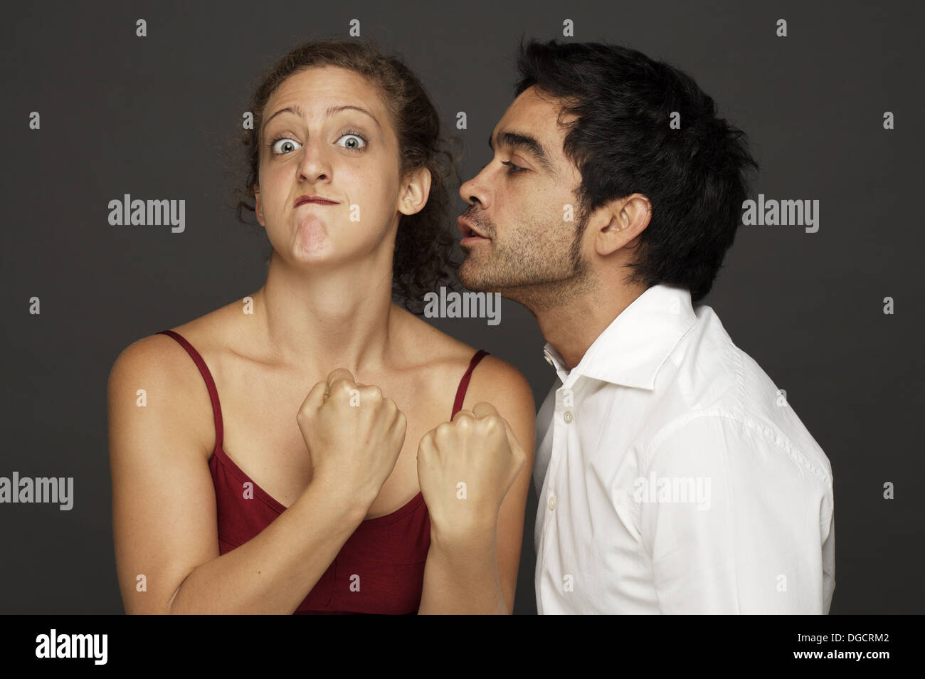 Man Tries To Kiss Woman While She Reacts In Fight Mode Stock Photo Alamy