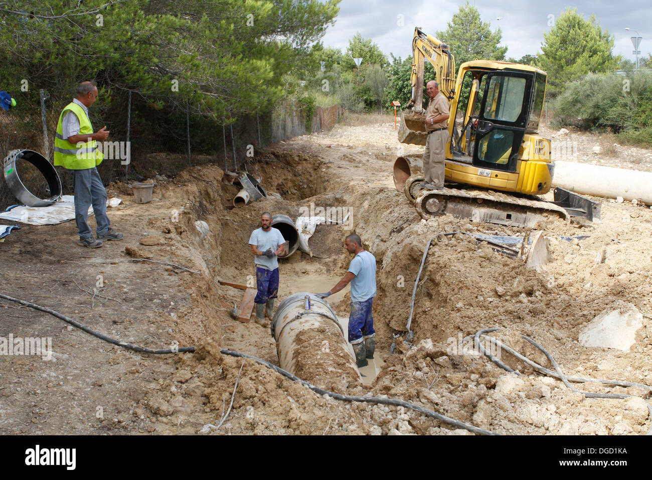 Workers on a broken water pipe outside of Palma de Mallorca, Spain Stock Photo