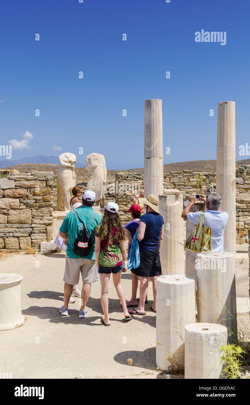 Tourists at the House of Cleopatra on Delos Island, Cyclades, Greece Stock Photo