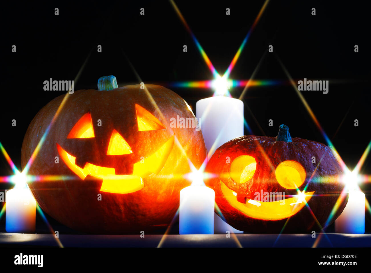 Funny Halloween pumpkins and burning candles Stock Photo