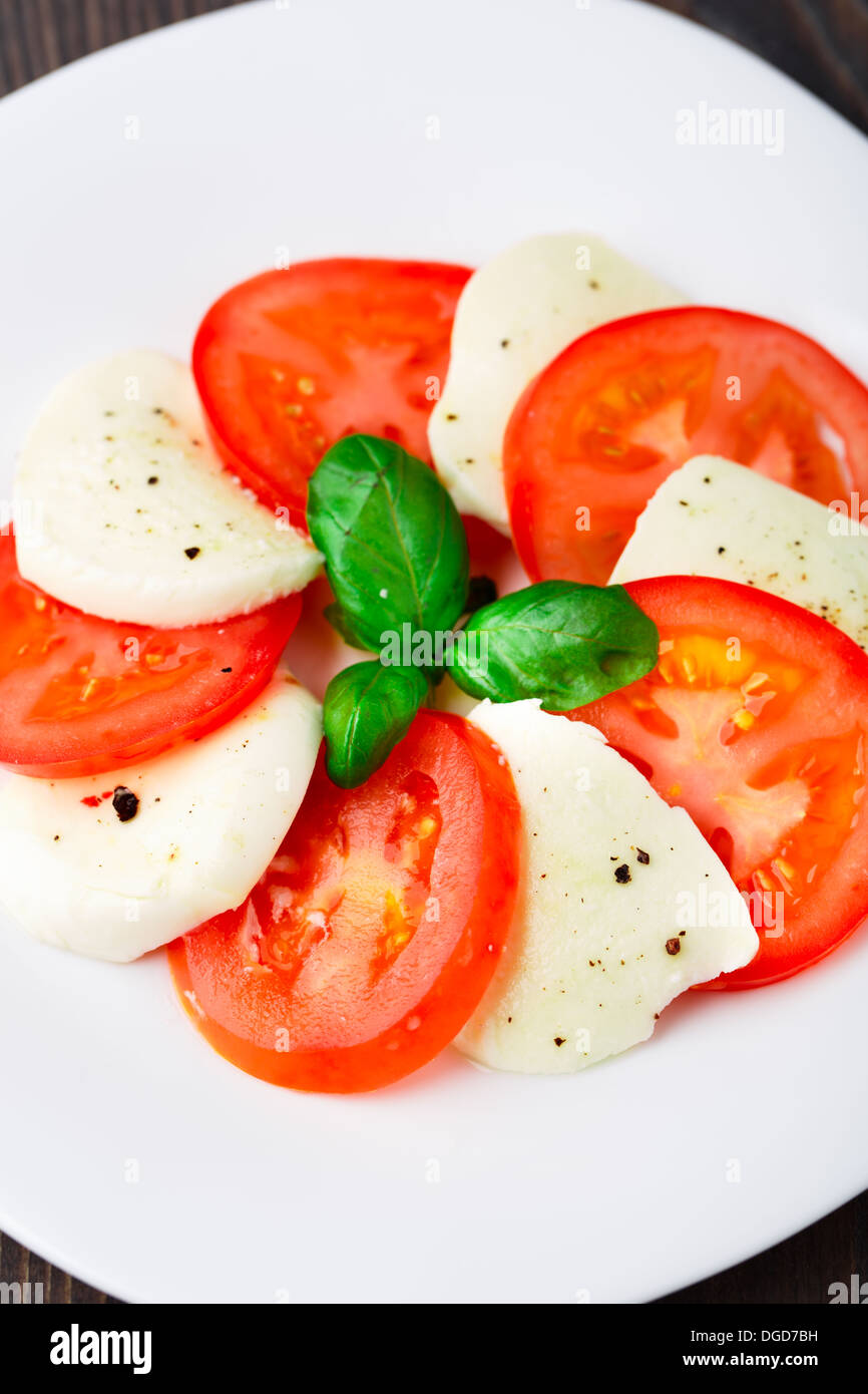 Tomato and mozzarella with basil leaves Stock Photo - Alamy