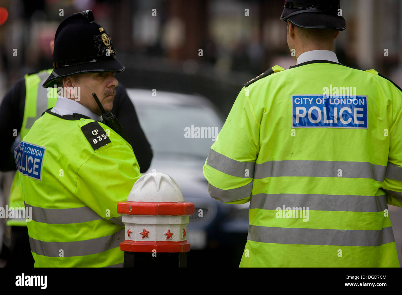 Officers from the City of London police, man a checkpoint looking for suspect vehicles and drivers entering at Aldgate. Stock Photo