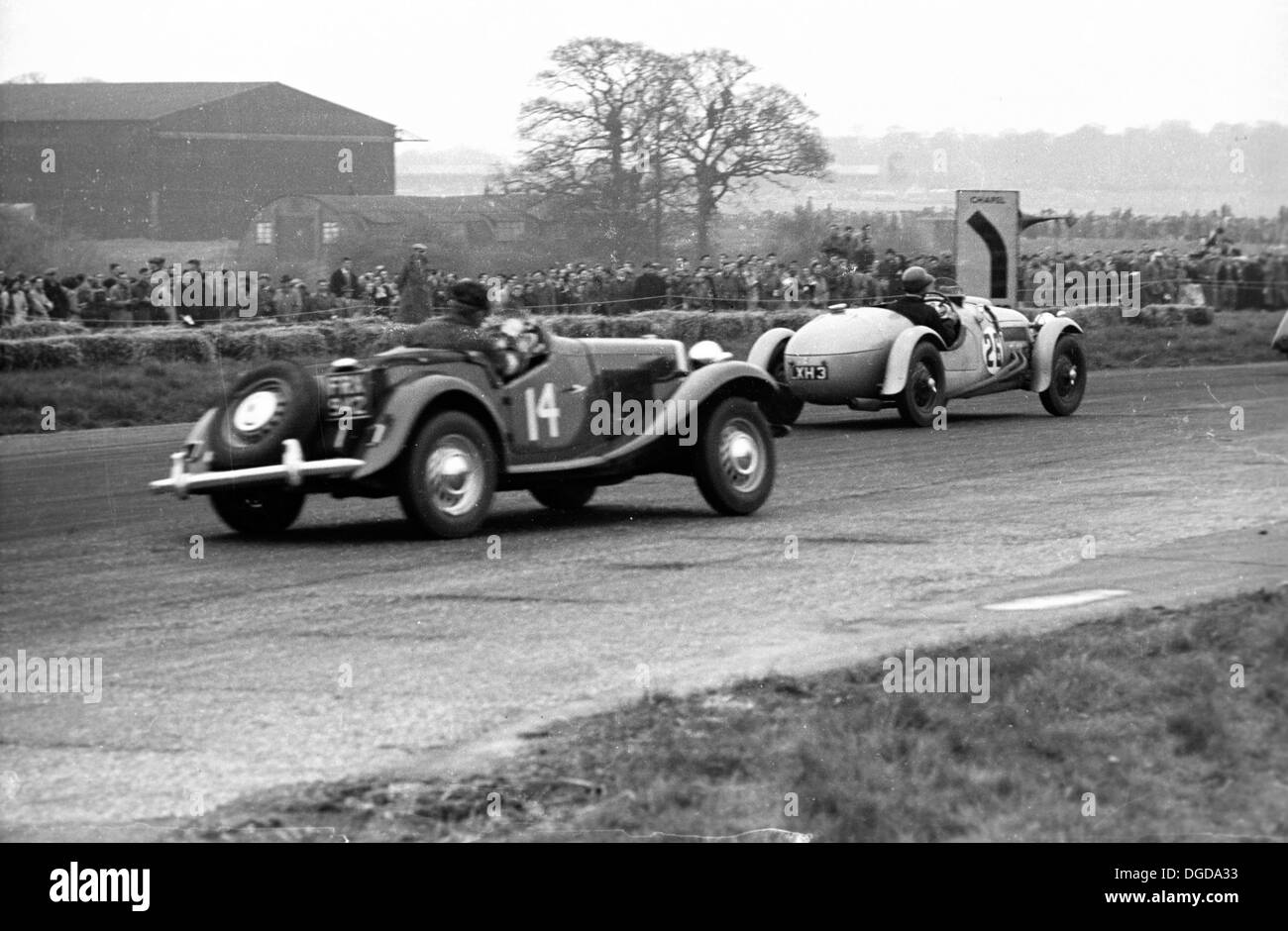Phillips in MG TD II lead by Peacock in Frazer Nash Le Mans Replica International Trophy, Silverstone, England, 5th May 1951. Stock Photo