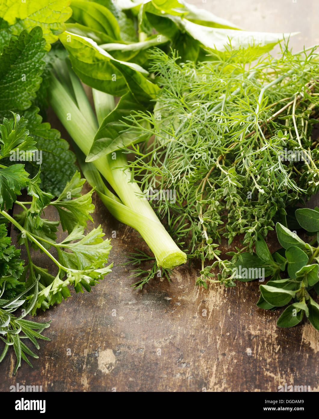 Fresh Herbs On A Rustic Wooden Surface Stock Photo
