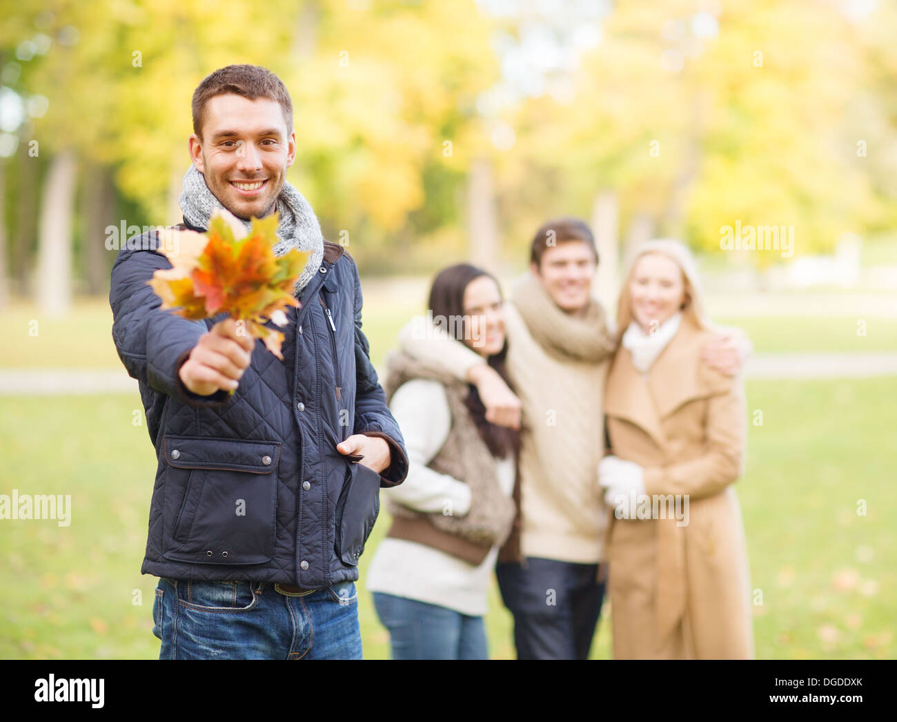 group of friends having fun in autumn park Stock Photo - Alamy