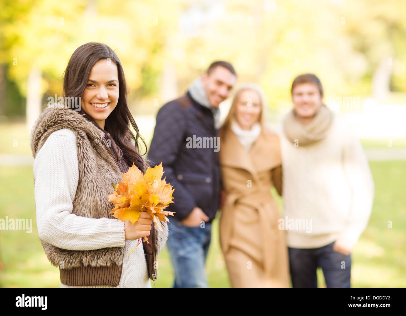 group of friends having fun in autumn park Stock Photo - Alamy