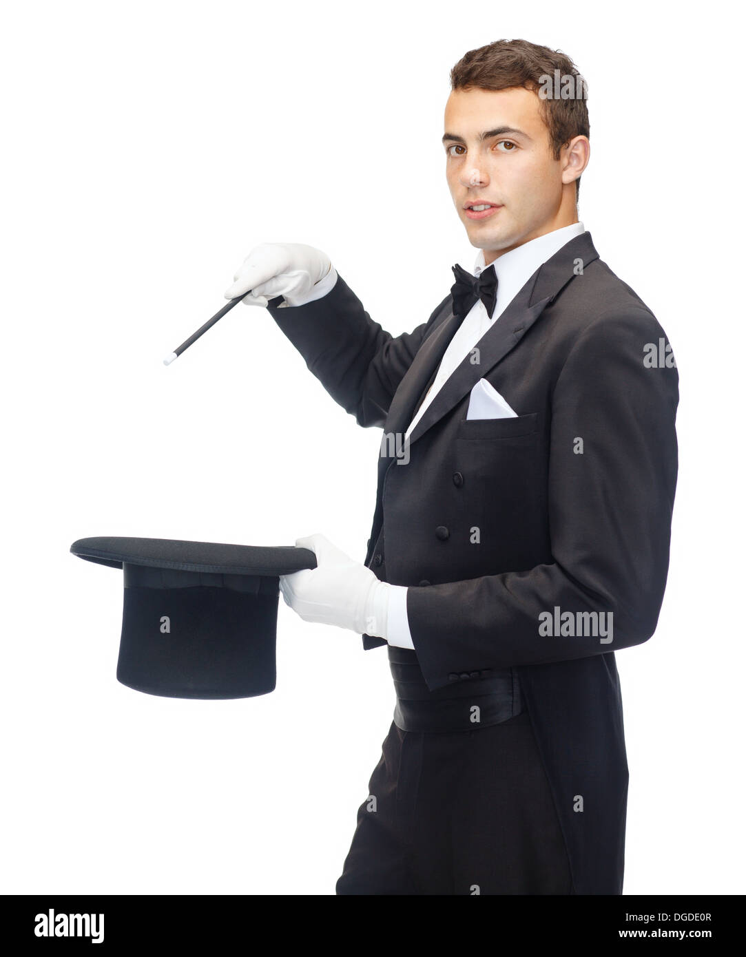 magician in top hat with magic wand showing trick Stock Photo