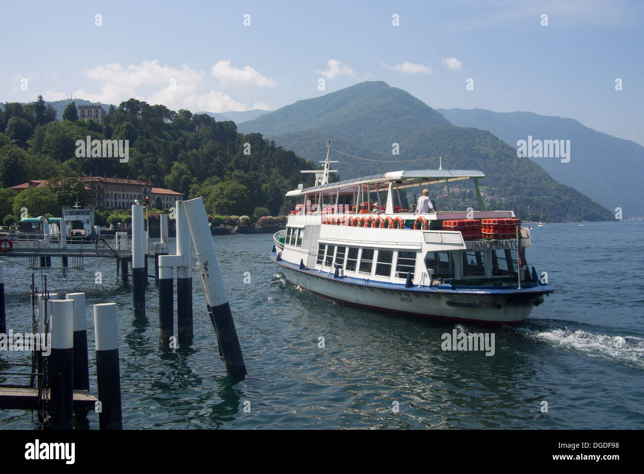 Passenger boat/ferry leaving Bellagio stop, Lake Como, Lombardy, Italy Stock Photo