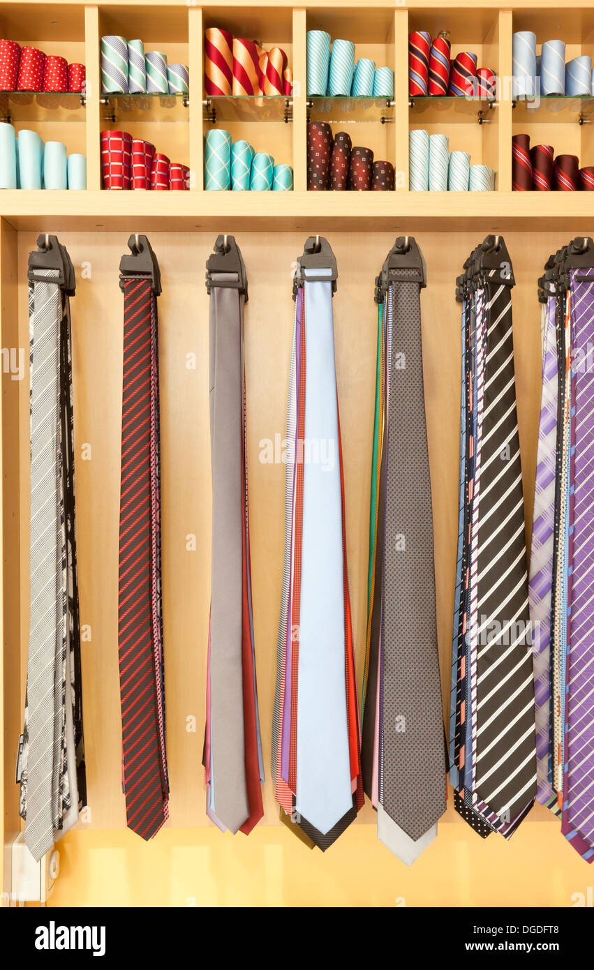 Men's ties stacked on the shelf for sale Stock Photo