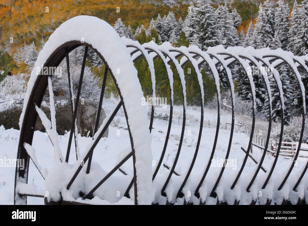 Rusted Farm Equipment abandoned Before a Winter Storm Stock Photo