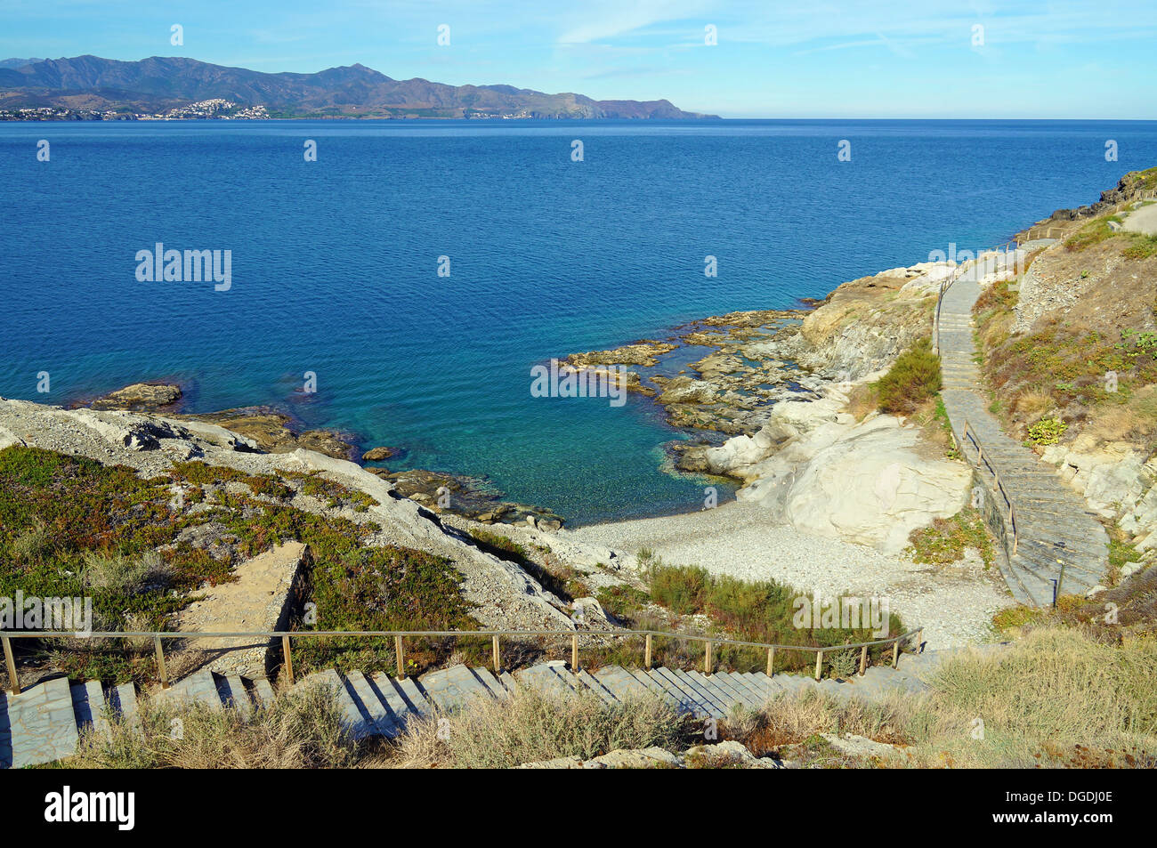 Stairs leading to peaceful Mediterranean sea cove, Puerto de la Selva, Costa Brava, Catalonia, Spain Stock Photo