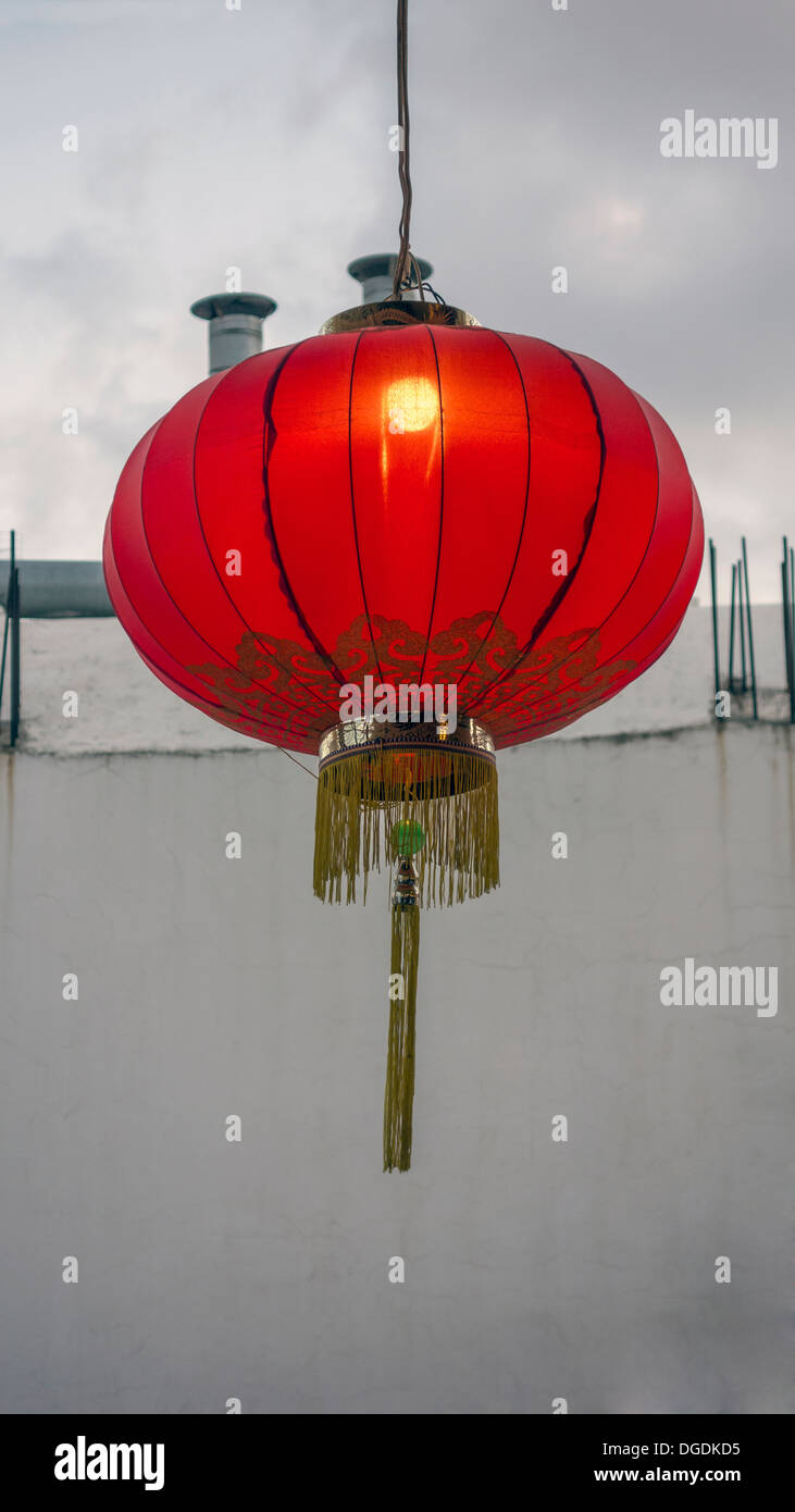 Red Lantern hanging on the wall Stock Photo