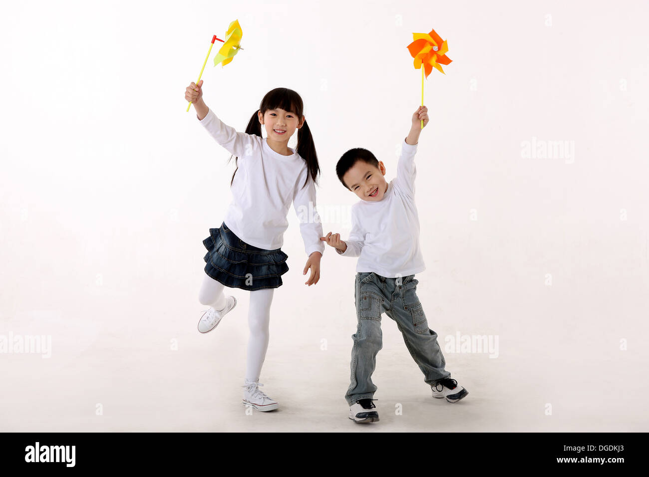 East Asian Children Playing Paper Windmill Stock Photo