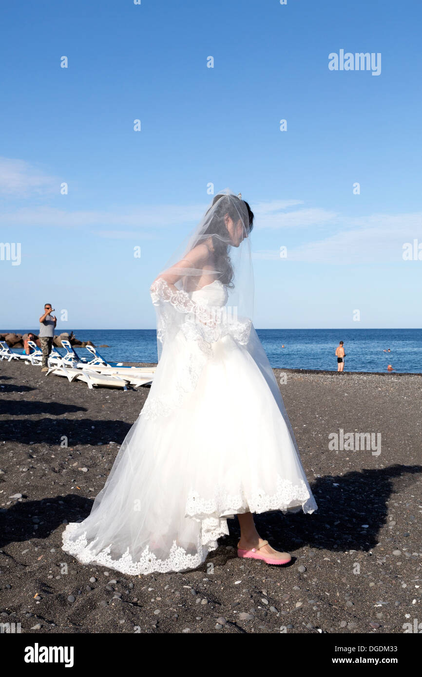 Wedding On The Beach Of Chinese Tourists In The City Of Kamari On
