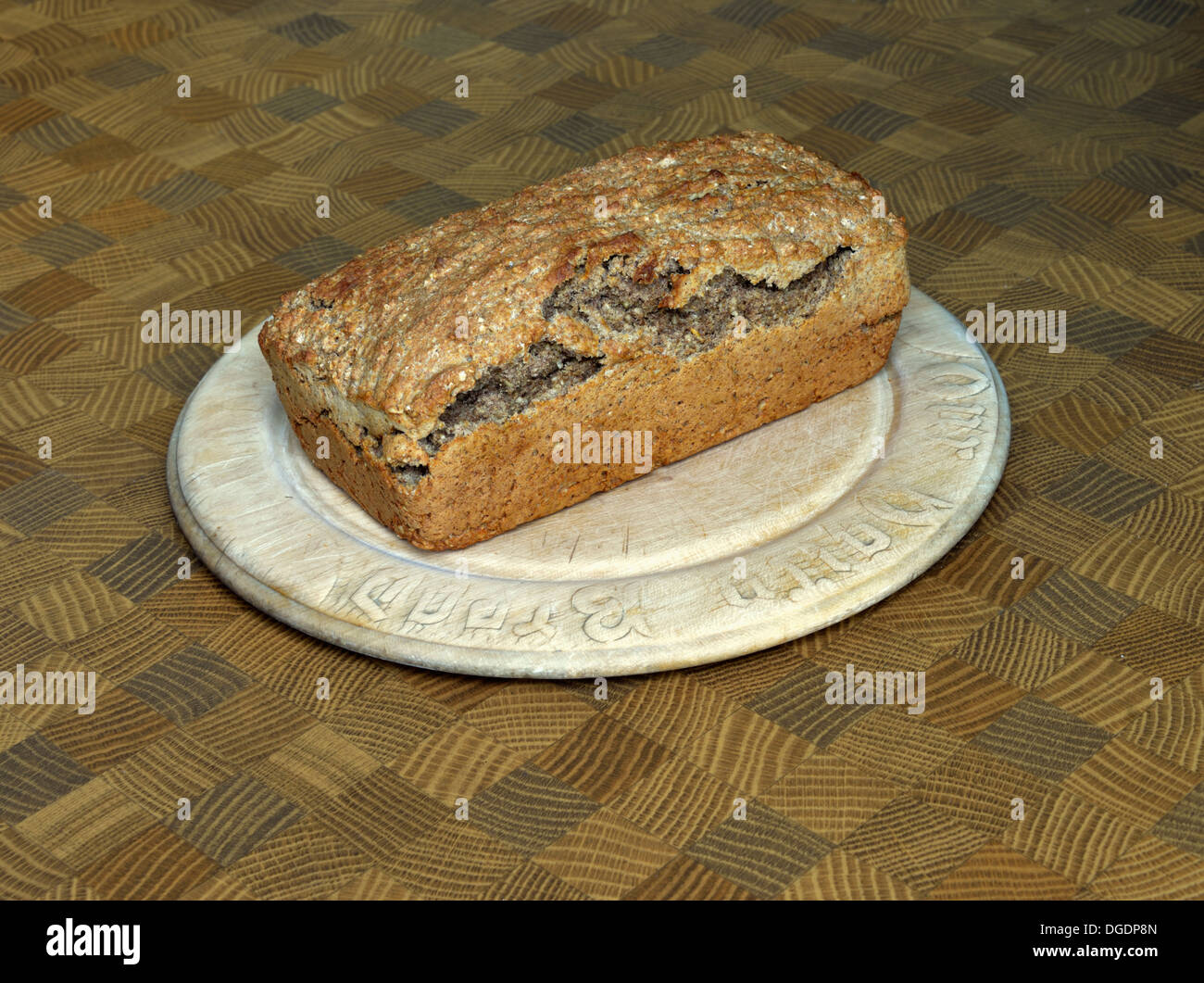 Loaf of Soda Bread on wooden bread board. Stock Photo