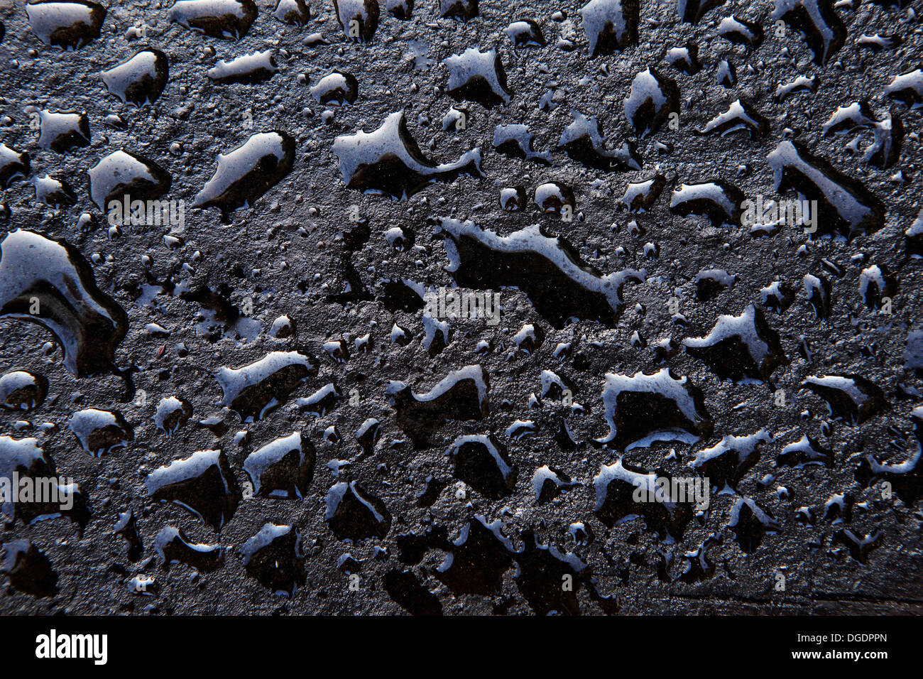 Water drops on oily wooden surface of railway sleeper Stock Photo