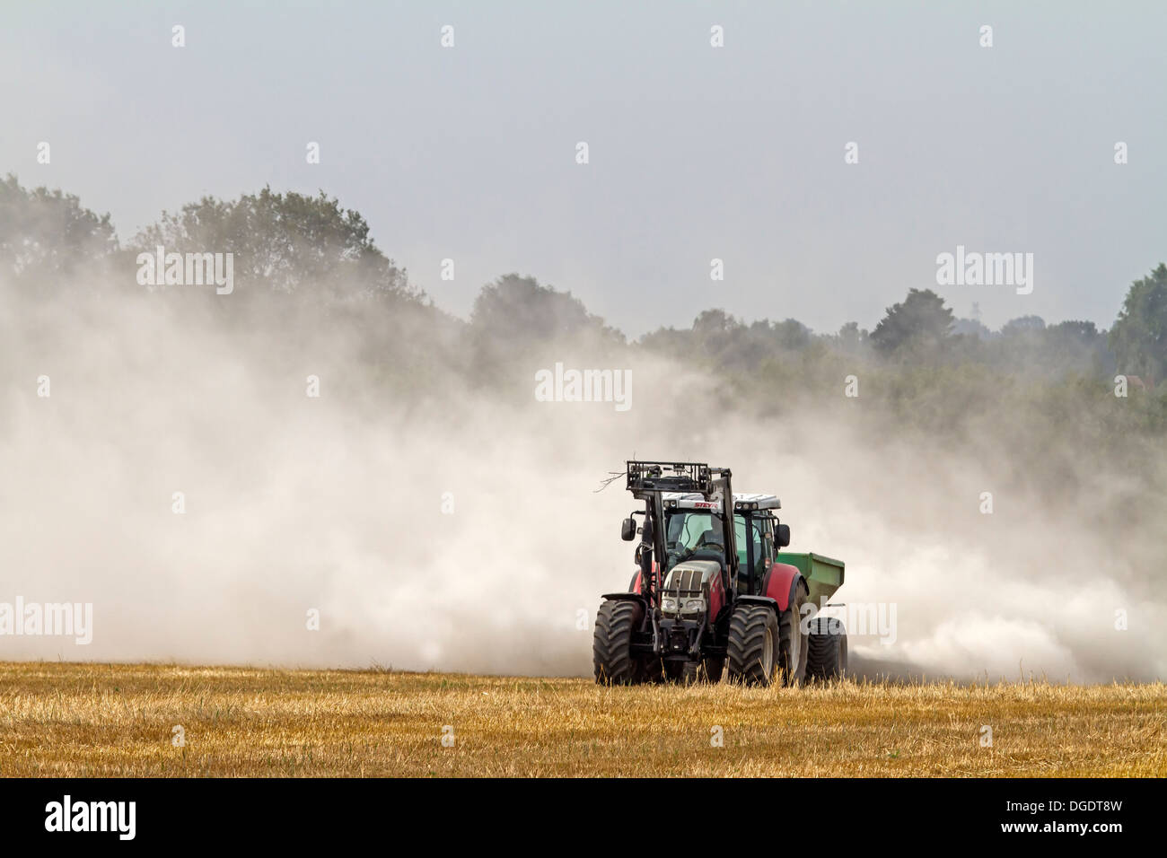 Tractor liming a field, Germany, Europe Stock Photo