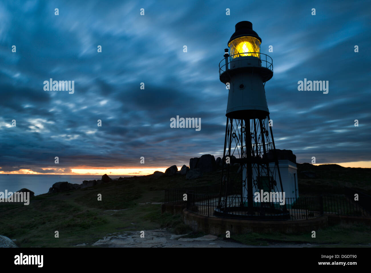 Sunset over Peninnis Head Lighthouse, St Mary's, Isles of Scilly, UK Stock Photo