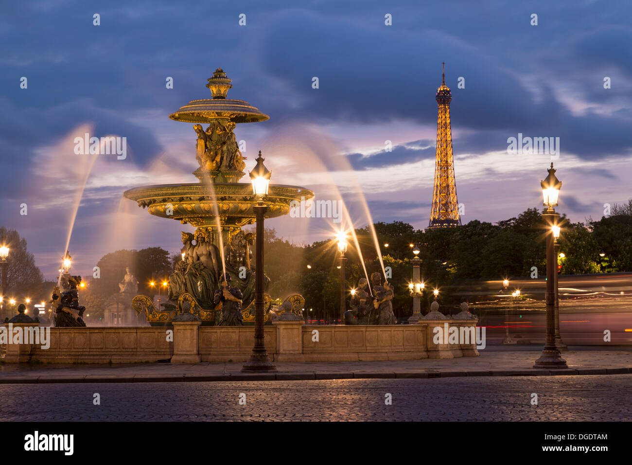 Place de la Concorde fountains and Eiffel Tower at sunset Paris France Stock Photo