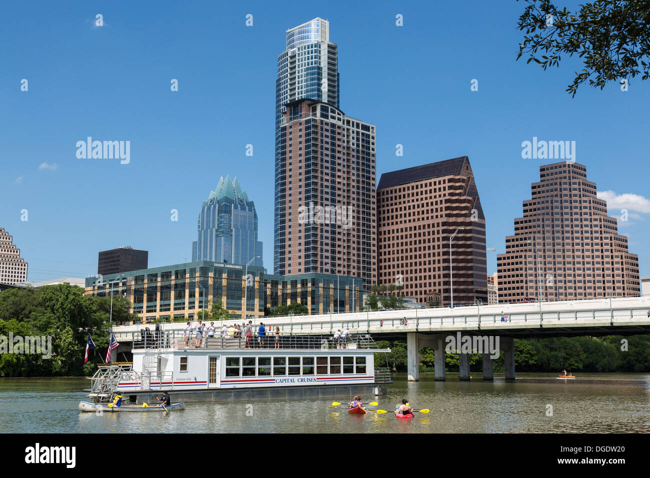 Tour boat on Lady Bird Lake Austin skyline Texas USA Stock Photo