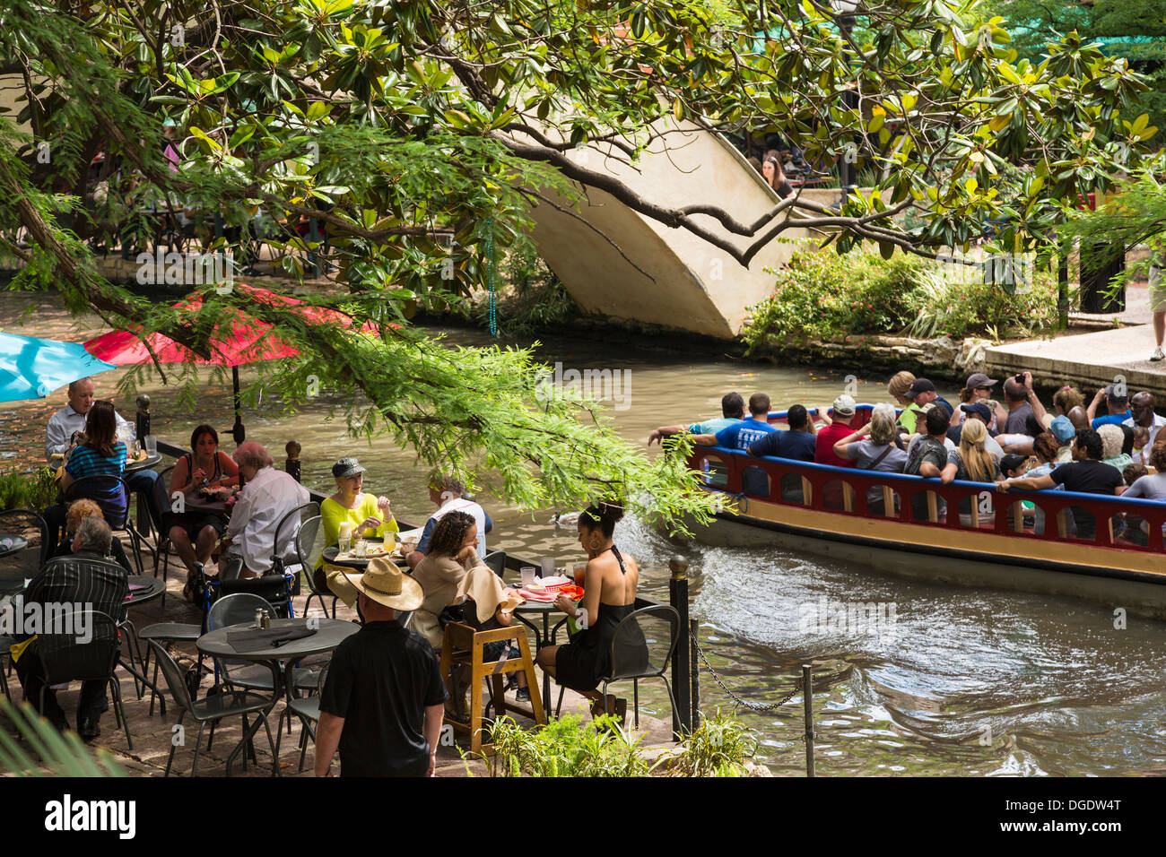 Tourists taking a boat ride along the San Antonio Riverwalk Texas USA Stock Photo