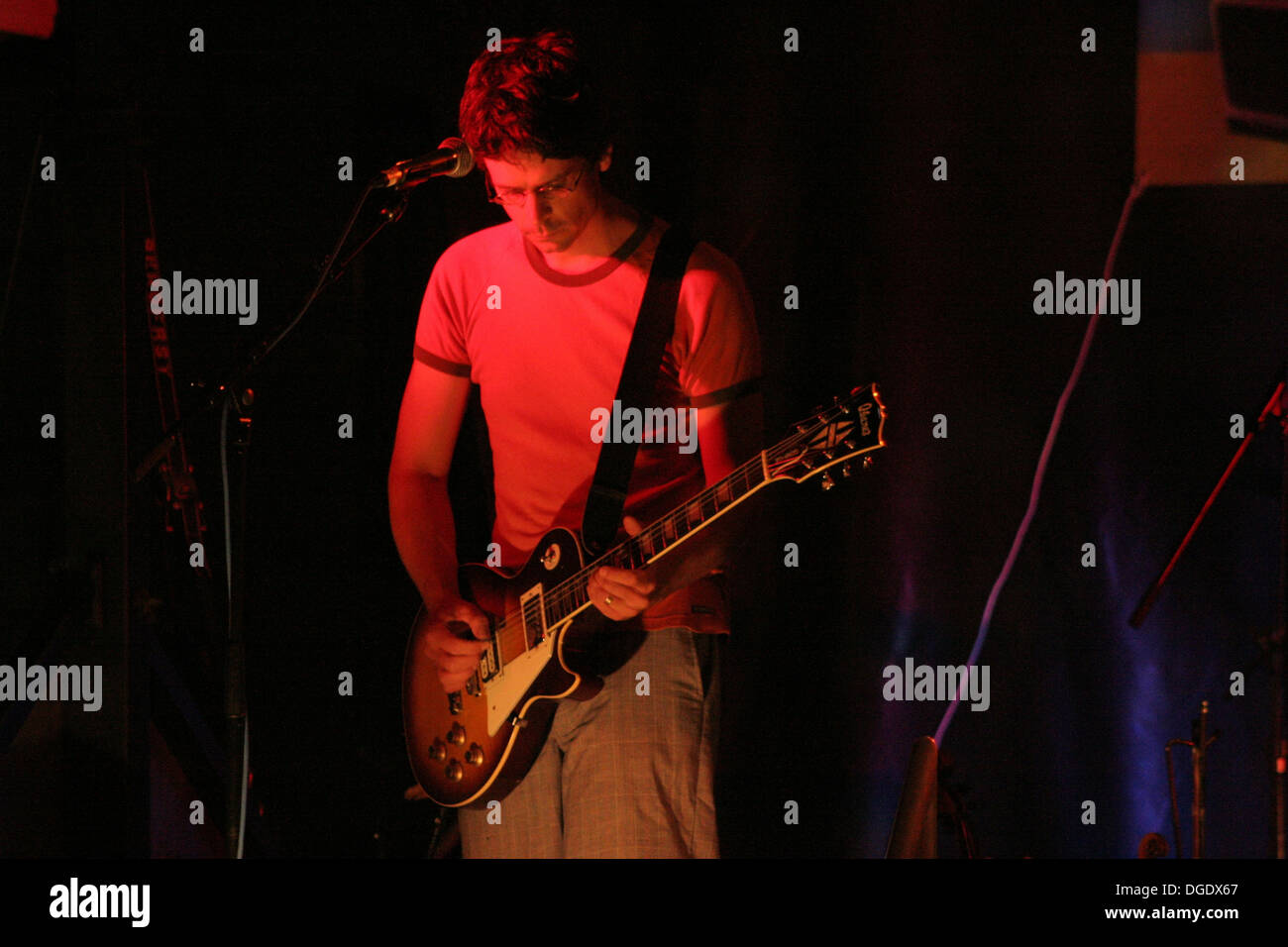 Musician playing electric guitar on stage Stock Photo Alamy