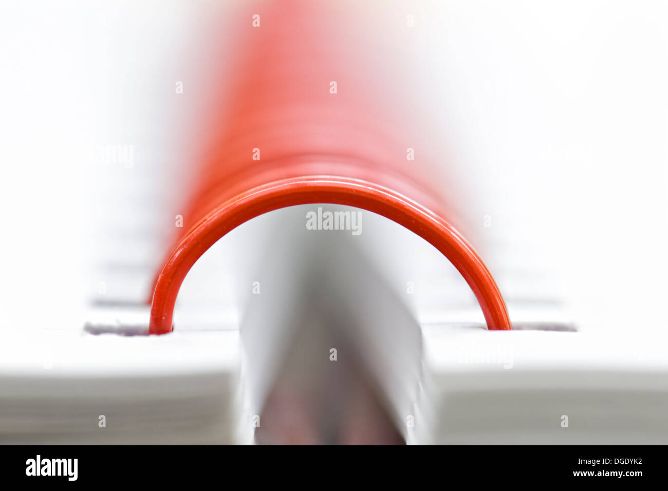 Red ring binder close up on a notebook Stock Photo