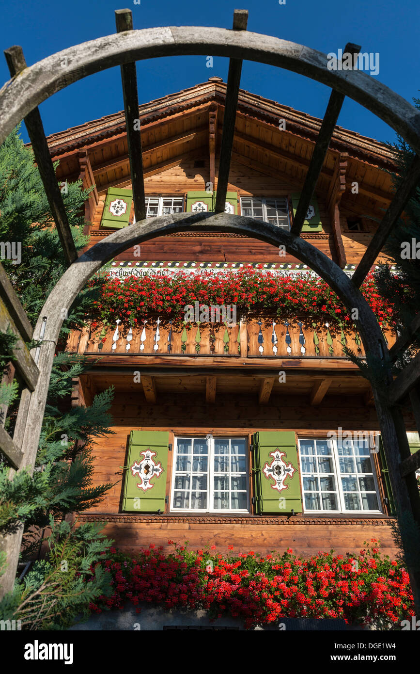 Traditional wooden shuttered Alpine house. Klosters Platz, canton of Graubunden, Switzerland Stock Photo