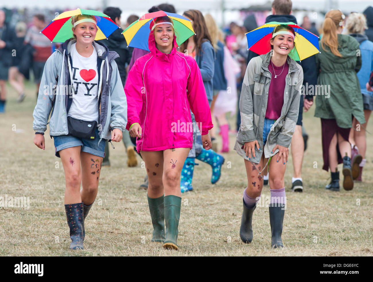 girls with umbrella hats head for the 