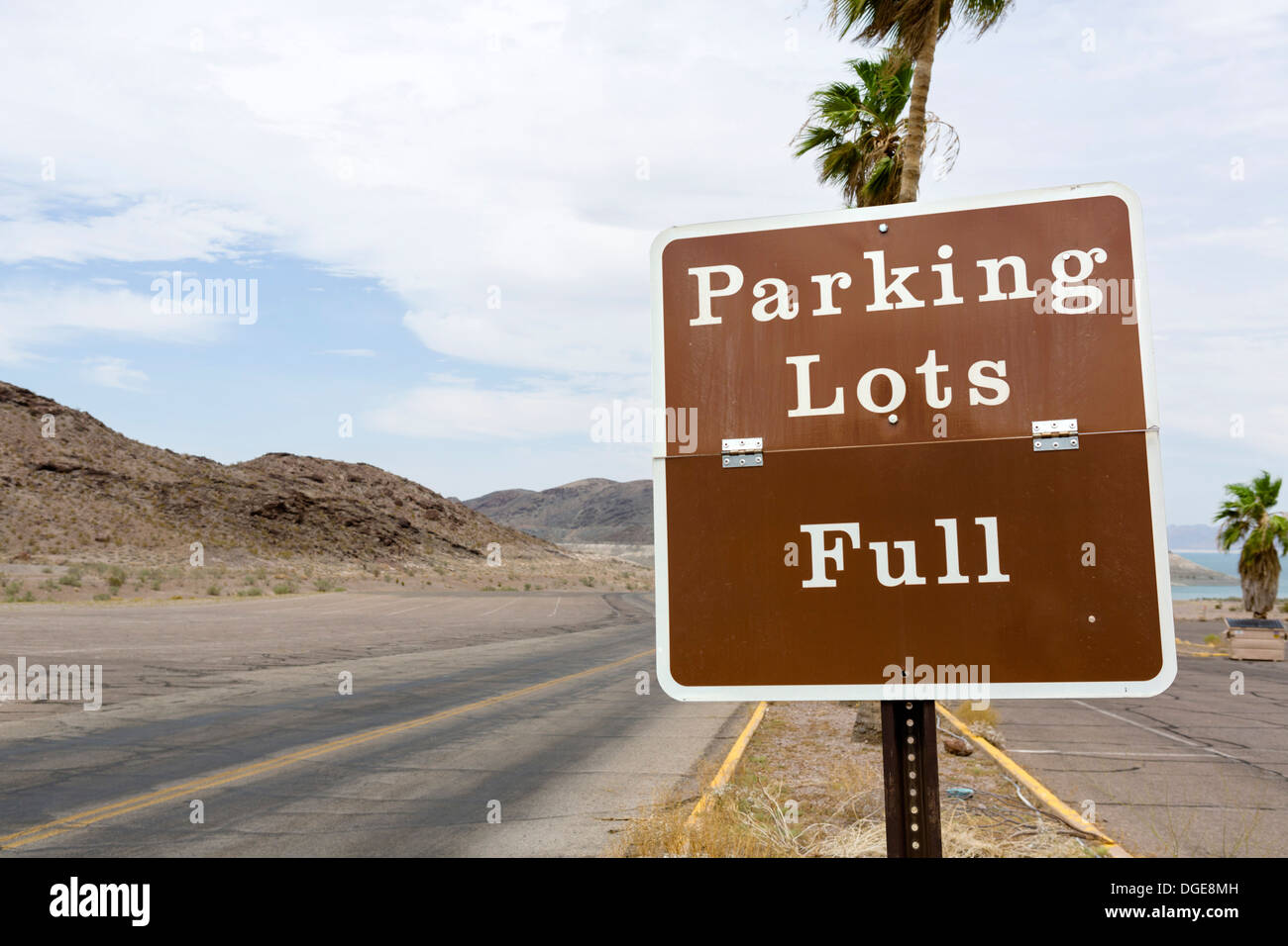 Ironic sign in an empty parking lot at Boulder Harbor, closed because of low water levels, Lake Mead in summer 2013, Nevada, USA Stock Photo