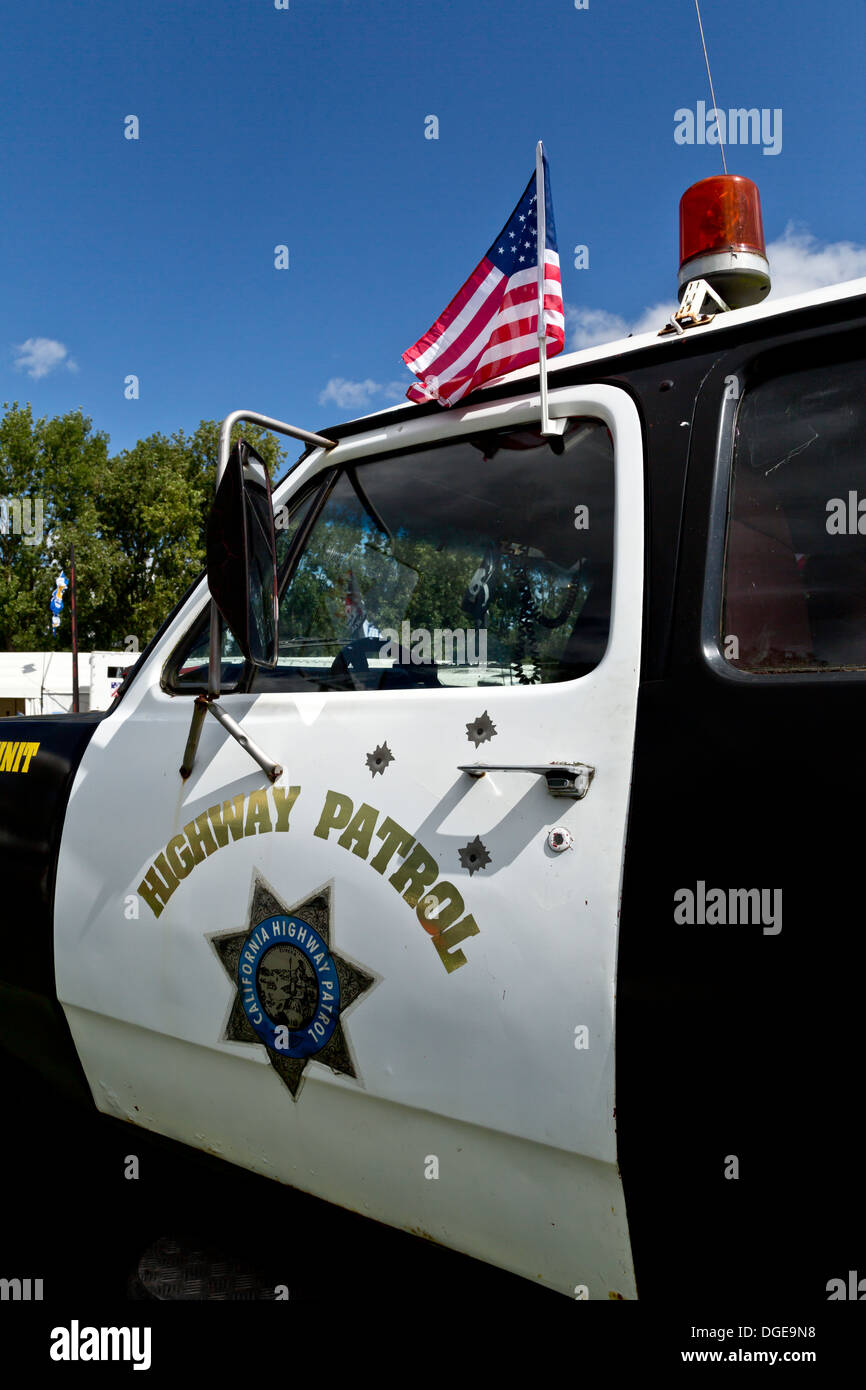 California Highway Patrol car with fake bullet holes American Auto Club International classic car show 2013 Northampton England Stock Photo