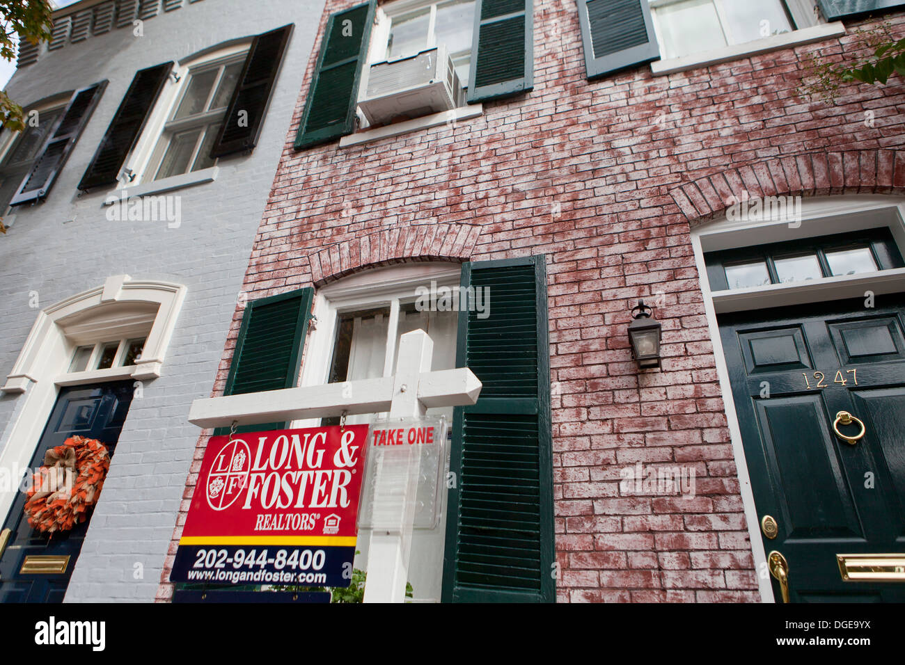 Realtor sign in front of townhouse - Washington, DC USA Stock Photo