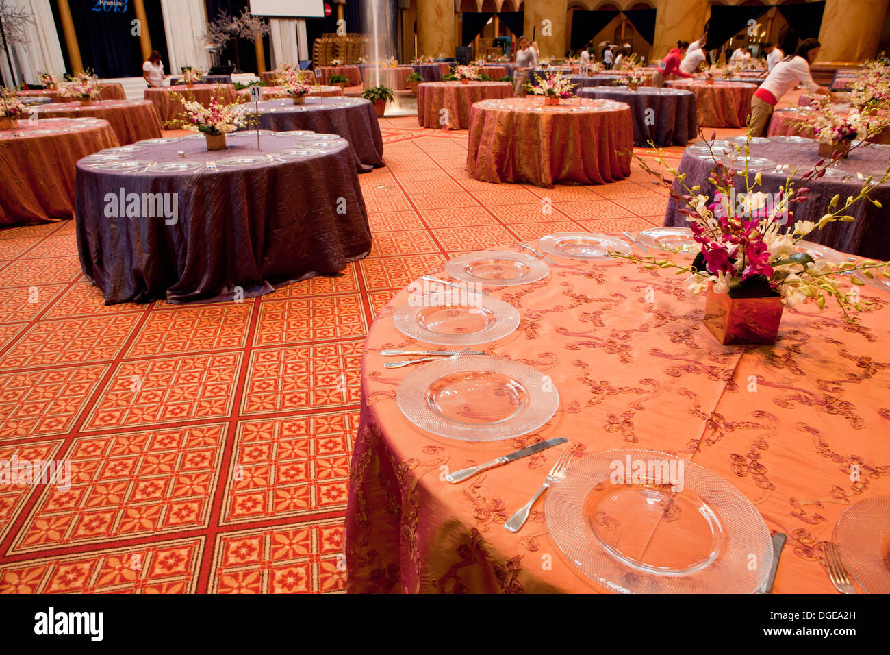 Round dining tables getting prepped for large dinner event Stock Photo