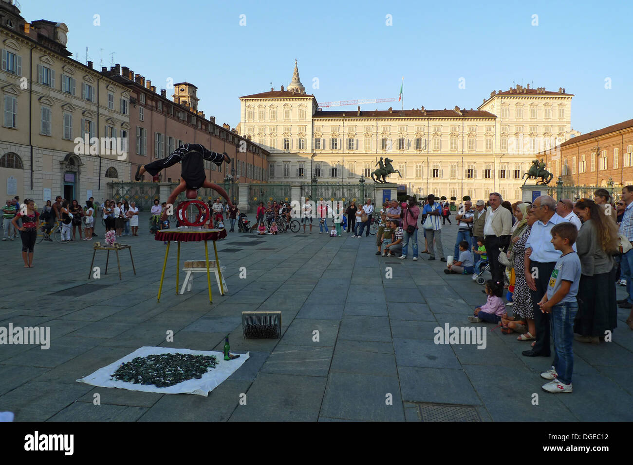 Piazza Castello, Turin, street performers perform in front of many people Stock Photo