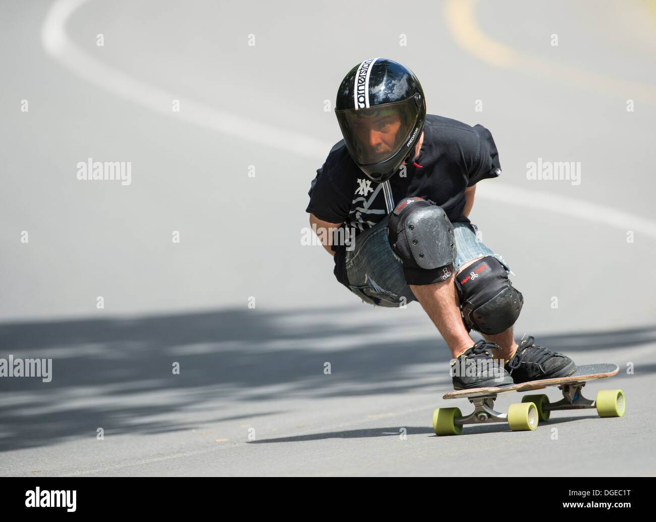 skateboard longboard training downhill on public road Stock Photo - Alamy