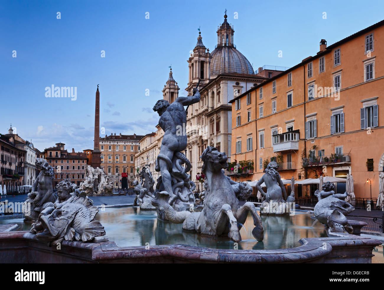 Italy Rome Piazza Navona square at sunrise landmark fountains and catholic church baroque art monuments blurred water four river Stock Photo