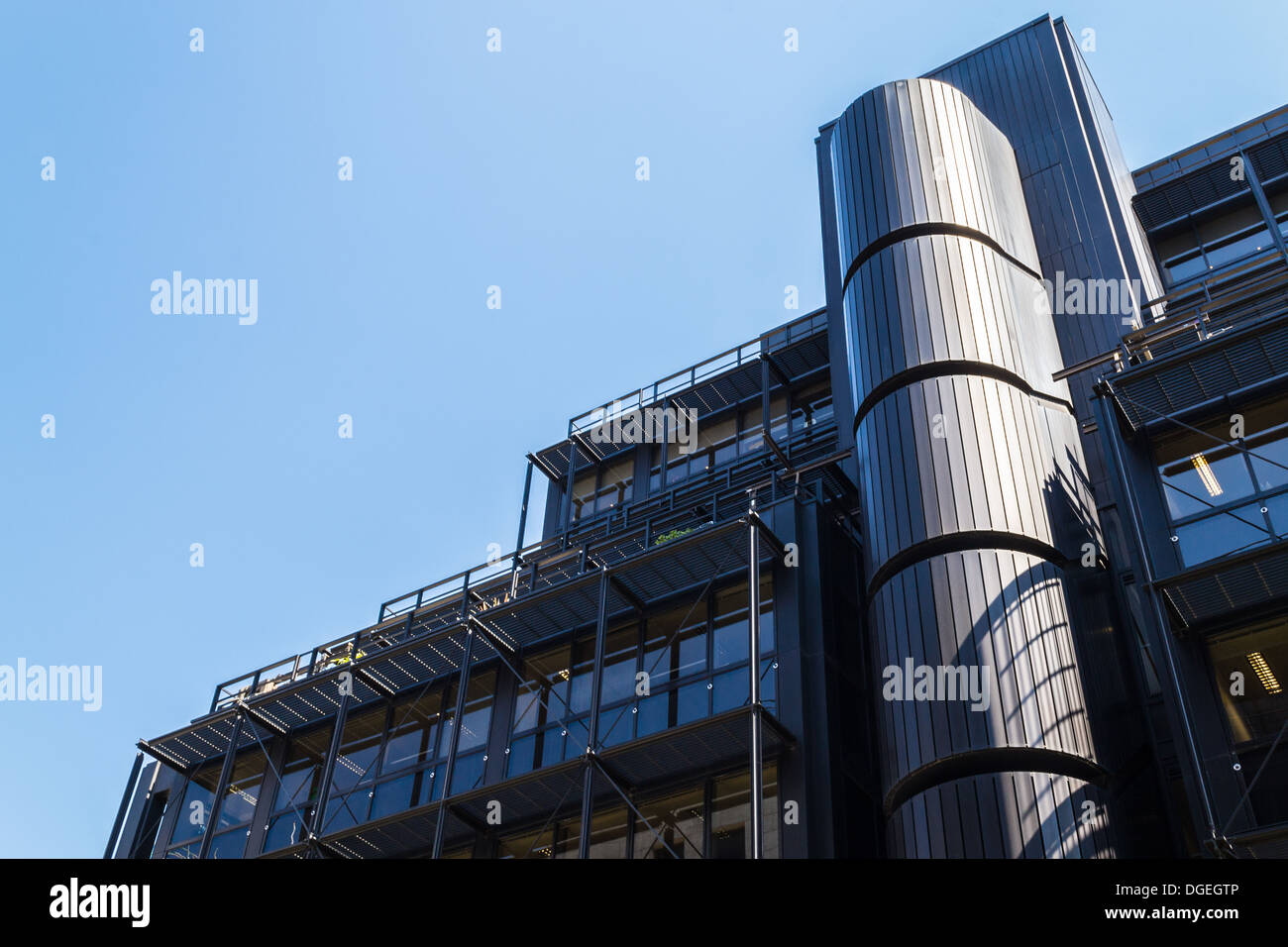 An office on Wilson Street with a strong vertical element rising from a facade in shade Stock Photo