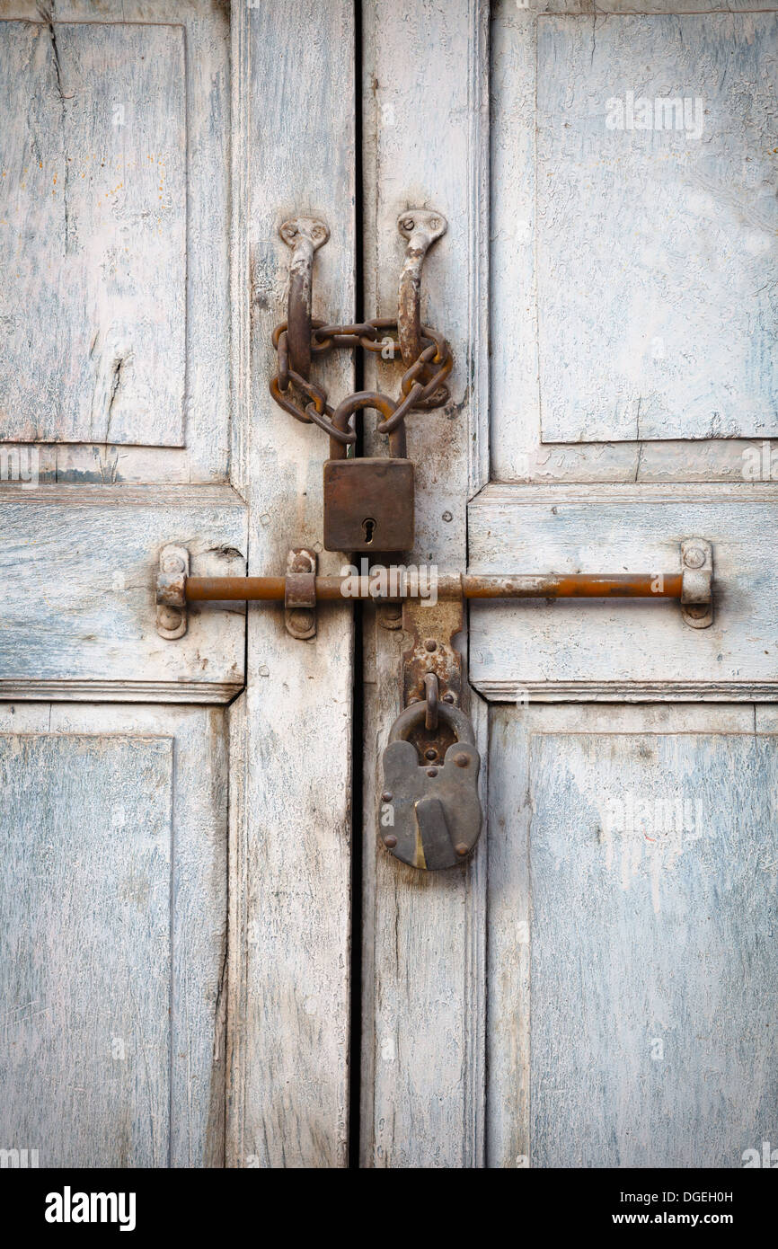 Two vintage padlocks on the old door Stock Photo
