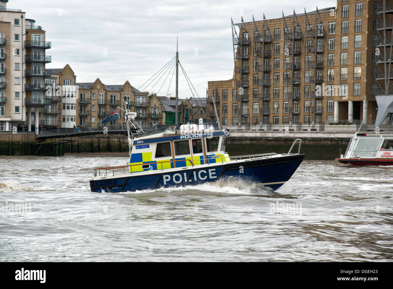 UK London Metropolitan Police Boat Sir Robert Peel II patrols the River Thames passing Limehouse East London. Stock Photo