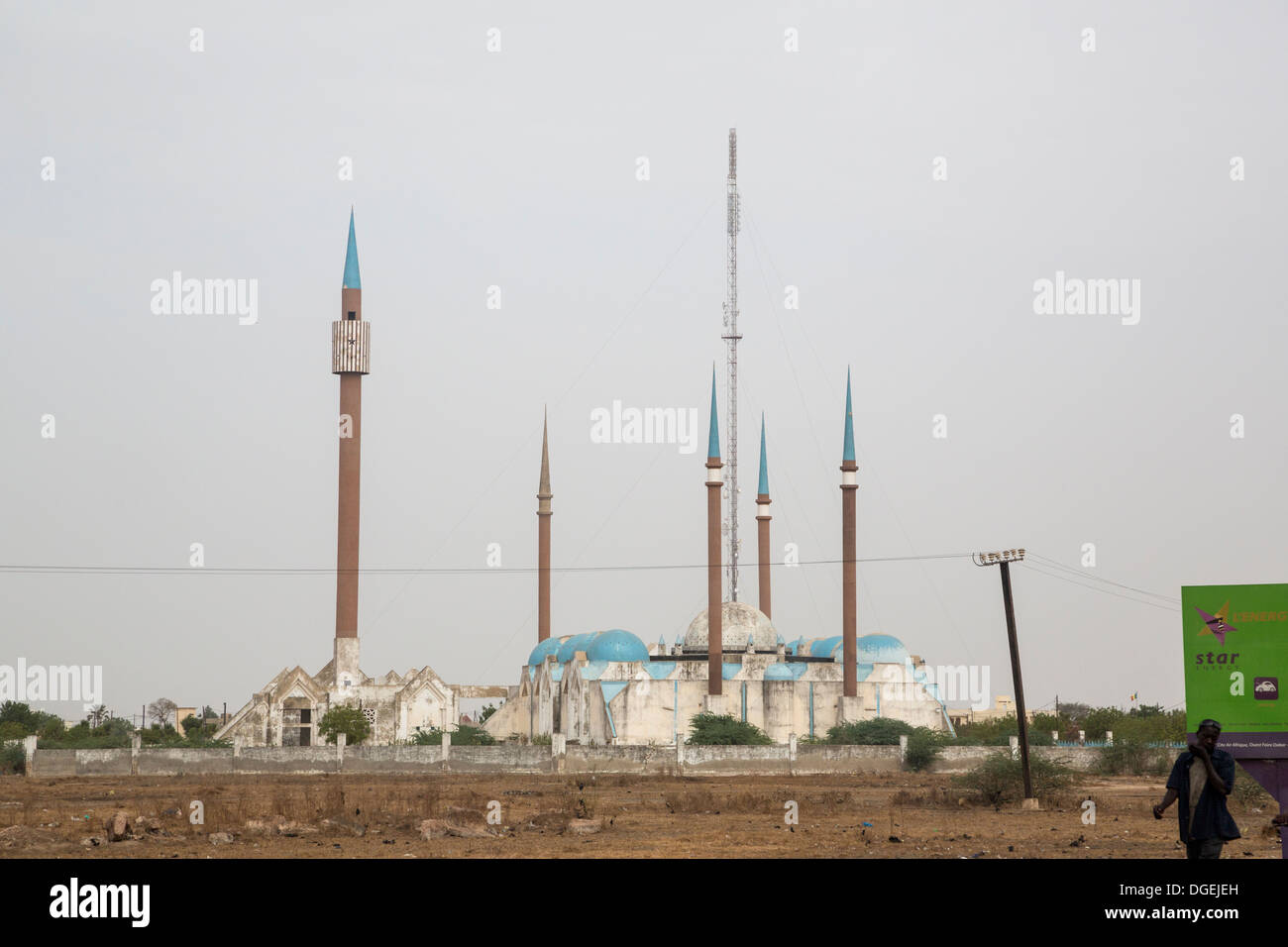 Mosque, Tall Minarets, and Telecommunications Tower, Kaolack, Senegal. Stock Photo