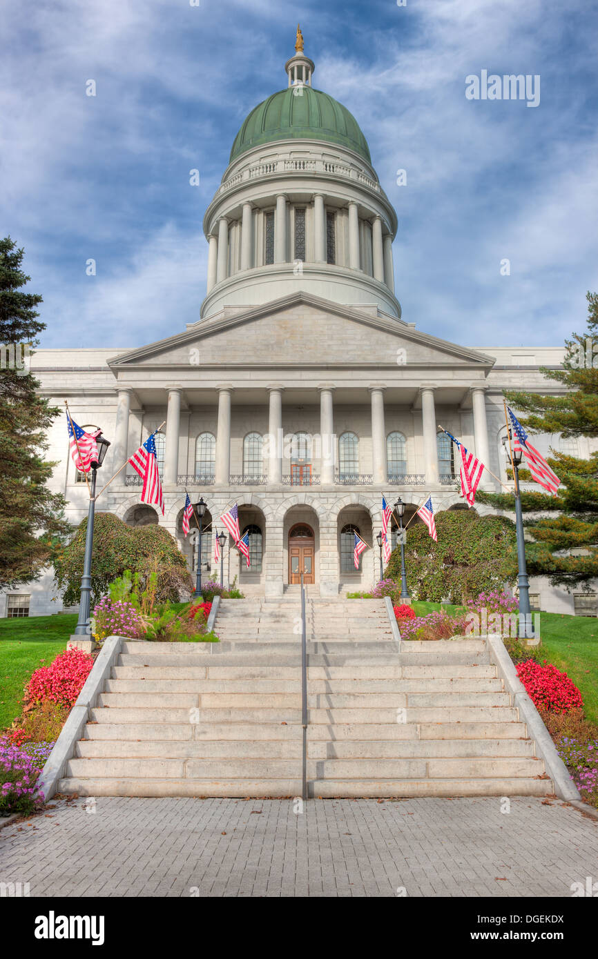 American flags flank the stairs to the front entrance of the Maine State House in Augusta, Maine. Stock Photo