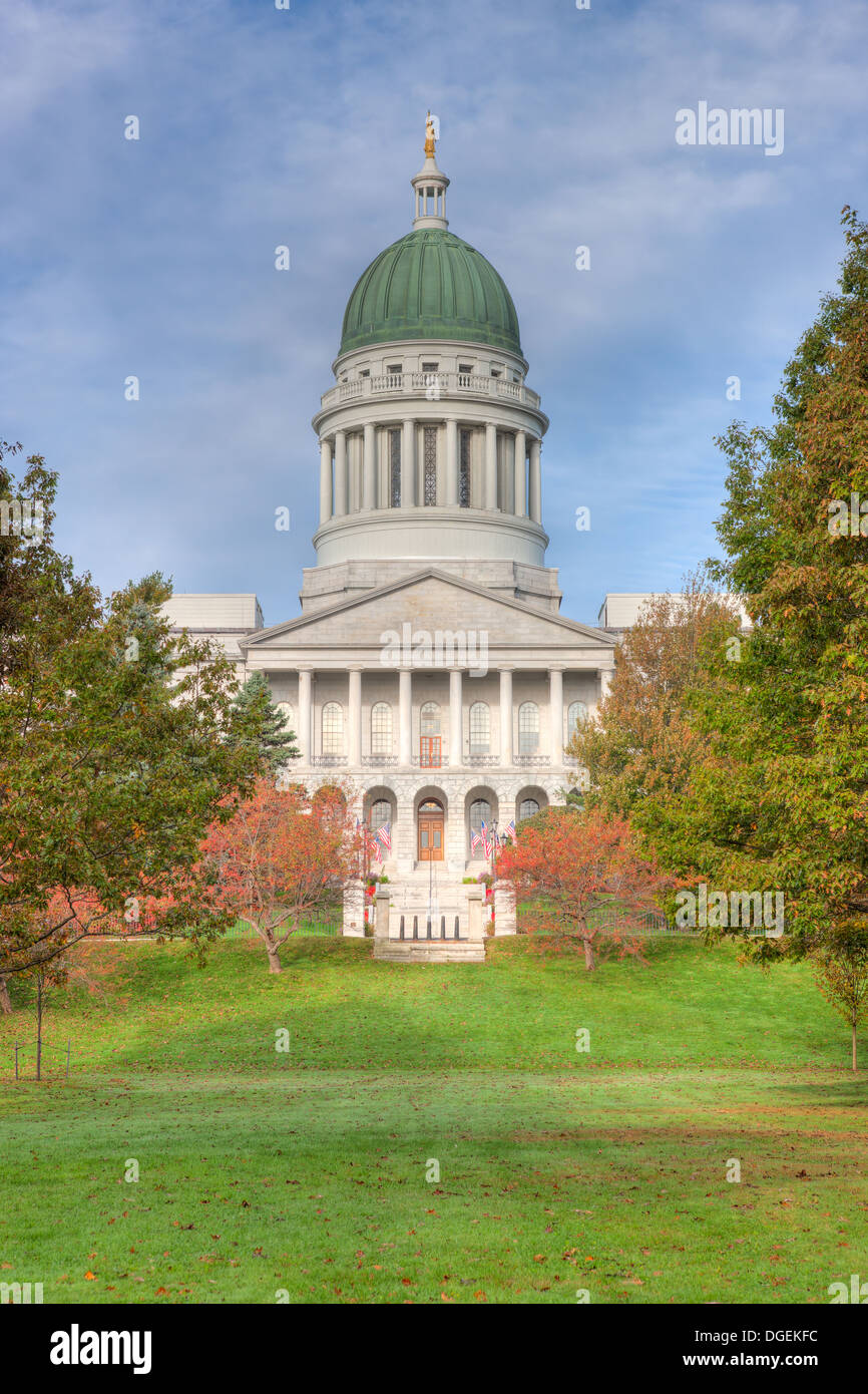 The Maine State House accented by the changing leaves of fall foliage in Augusta, Maine. Stock Photo