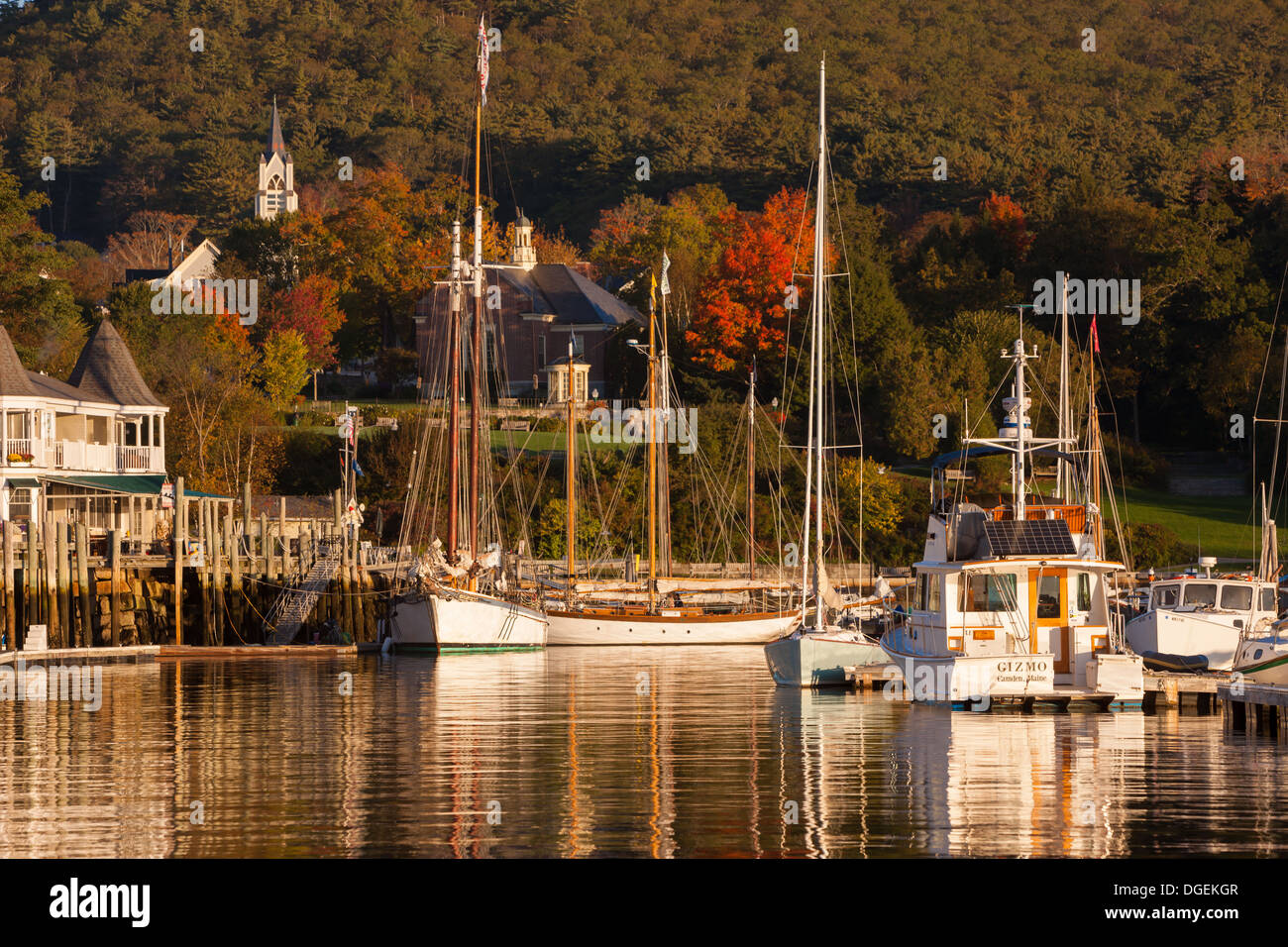 Sailboats docked shortly after sunrise in Camden harbor, Camden, Maine. Stock Photo