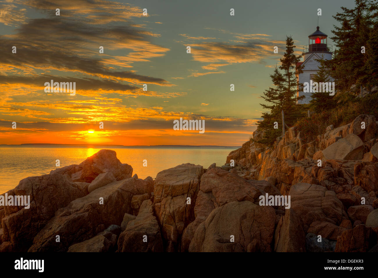Bass Harbor Head Light overlooks the entrance to Bass Harbor and Blue Hill Bay just before sunset in Acadia National Park. Stock Photo