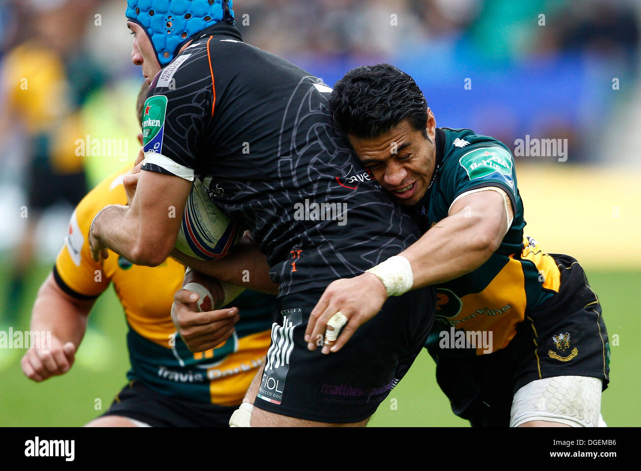 Northampton, UK. 20th Oct, 2013. George Pisi tackles Justin Tipuric of ...