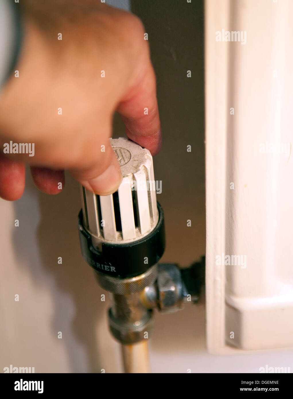Adjusting thermostatic radiator valve, London Stock Photo Alamy
