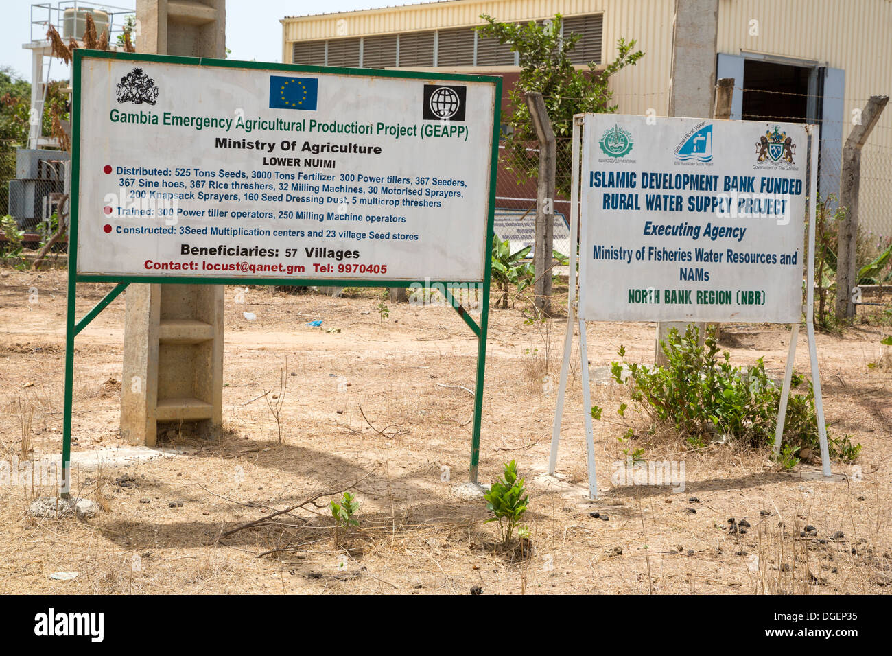 Foreign Aid Signs. Islamic Development Bank Water Project, European Union Agricultural Project, North Bank Region, The Gambia. Stock Photo