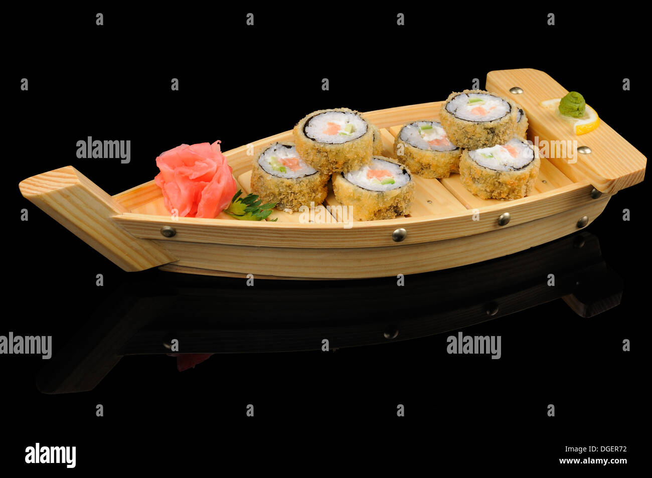 Japanese cuisine: hot rolls on the boat Stock Photo