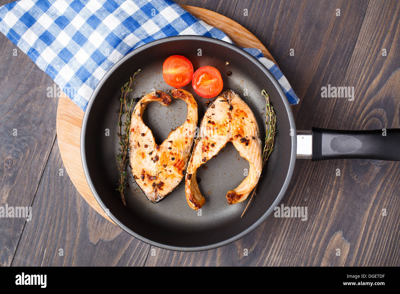 Salmon steak with thyme and pepper Stock Photo Alamy